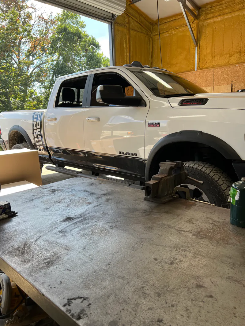 Pickup truck inside a McElroy Auto Repair service bay